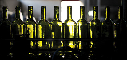 a line of empty wine bottles