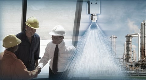 group of men and spray nozzle spraying