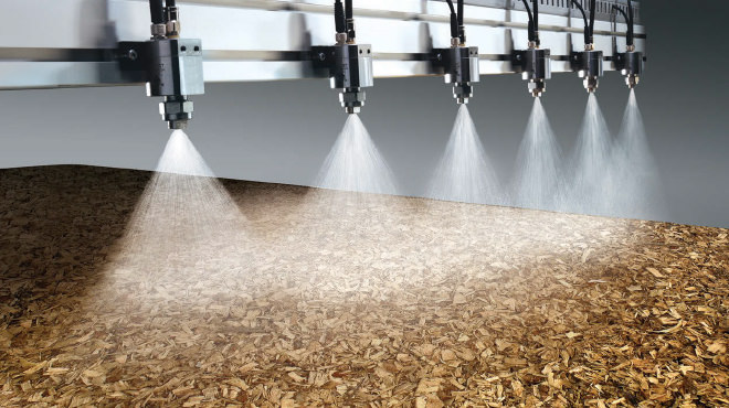 Header spraying on engineered wood plate