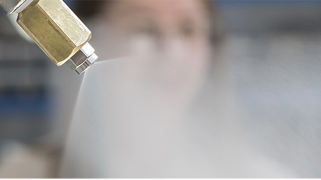 close up of nozzle spraying water