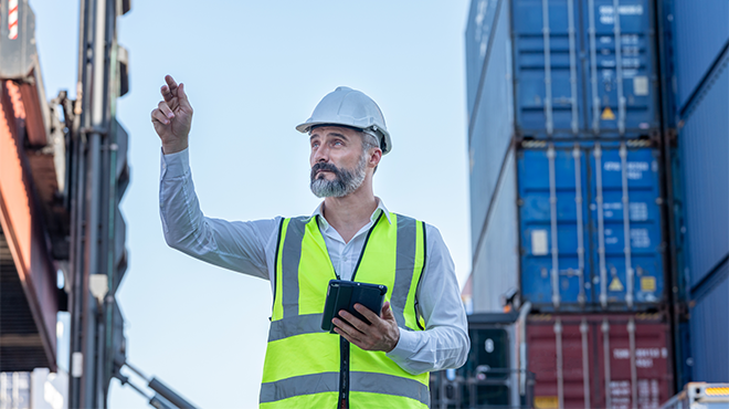 man pointing in hard hat