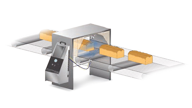 automatic spray nozzle spraying on bread