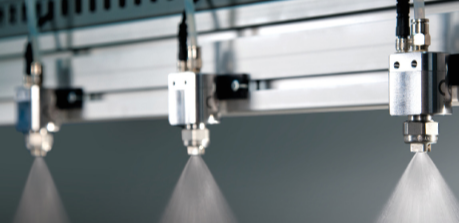 Cabezal con boquillas de pulverización