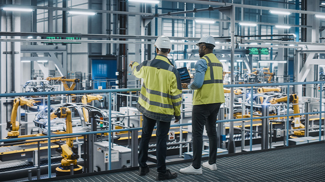 workers in a vehicle manufacturing plant