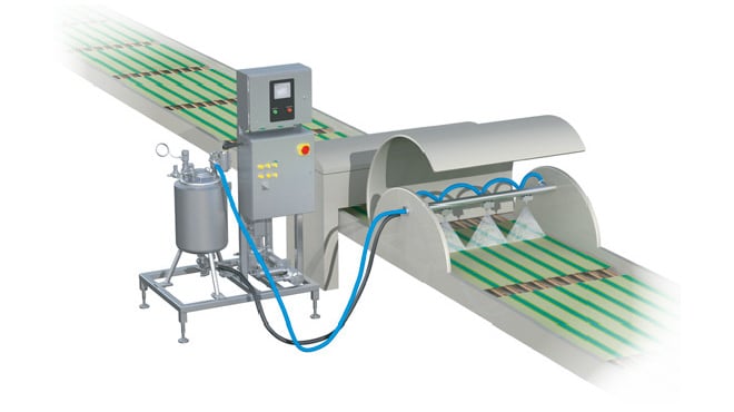 Sistema de pulverización de cera calentada para la fabricación de latas