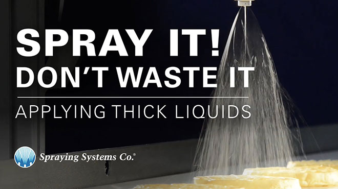 nozzle spraying over waffles on conveyor