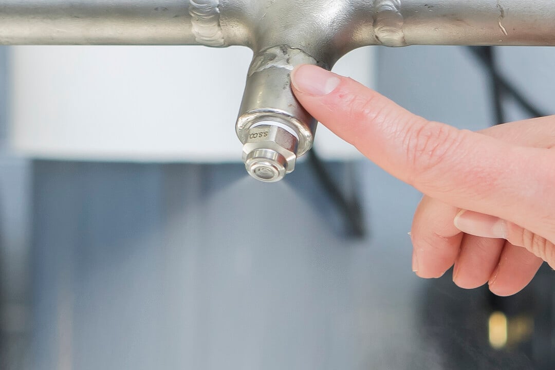 Pointing to a nozzle on a header