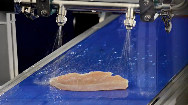 AutoJet Food Safety System spraying on Fresh Meat