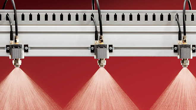 collecteur avec trois buses pulvérisant de l'eau