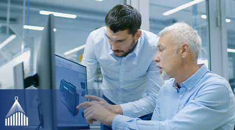 employees looking at computer screen