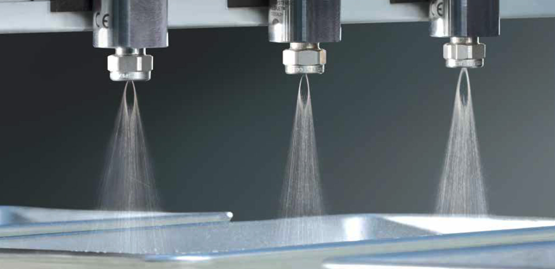 autojet system spraying metal pans