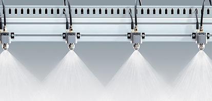 spray nozzles spraying water on manifold