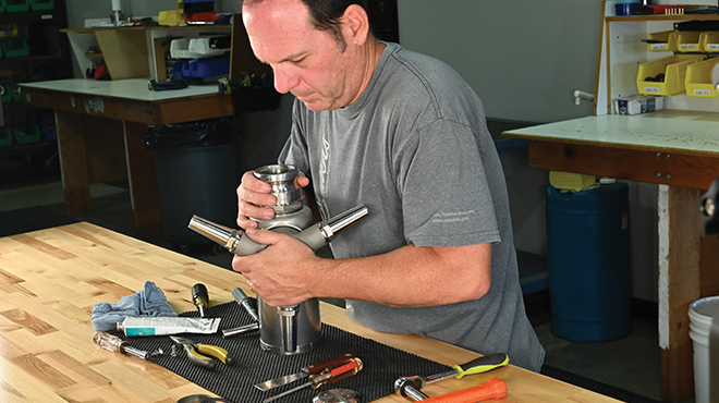 man assembling a tankjet nozzle