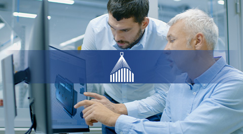 employees looking at computer screen with icon overlay